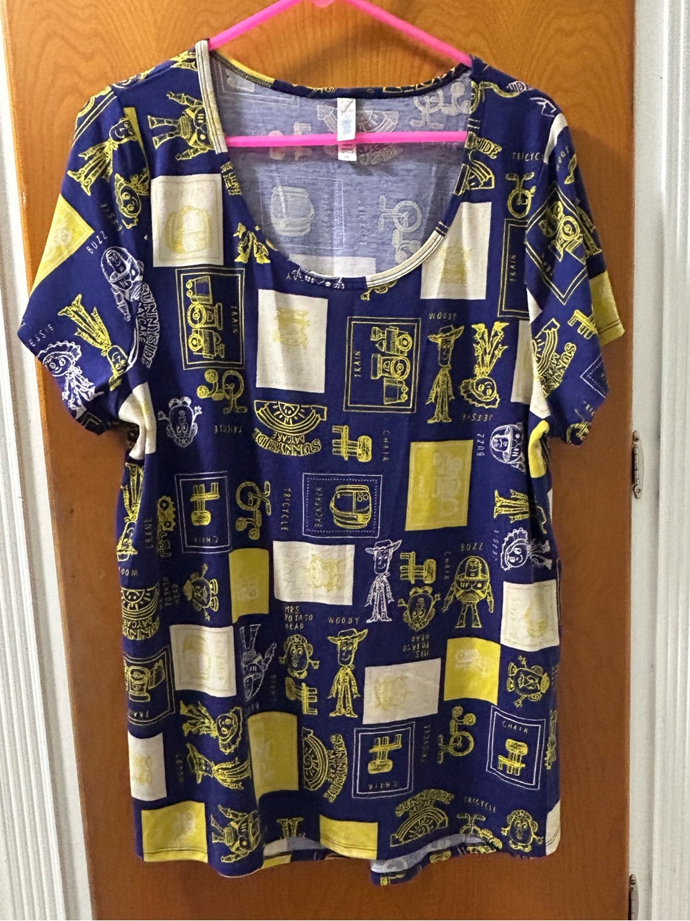 LuLaRoe  Disney Toy Story Navy Scoop Neck Top with Yellow and Cream